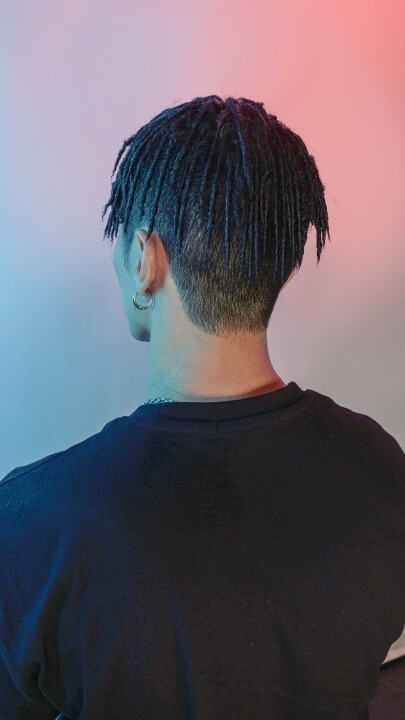 It's a men's dreads perm hairstyle.